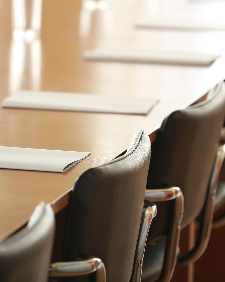 A row of empty chairs in warm light